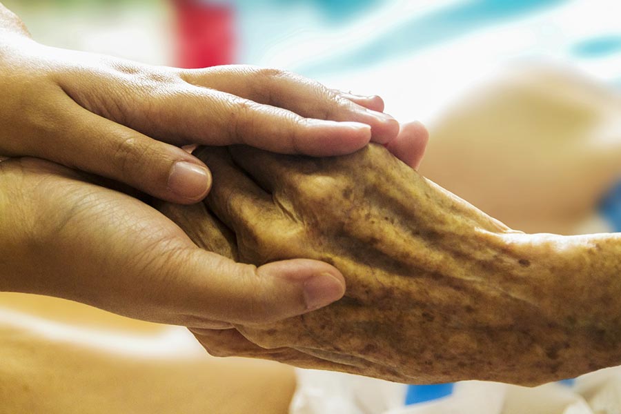 hospice holding hands