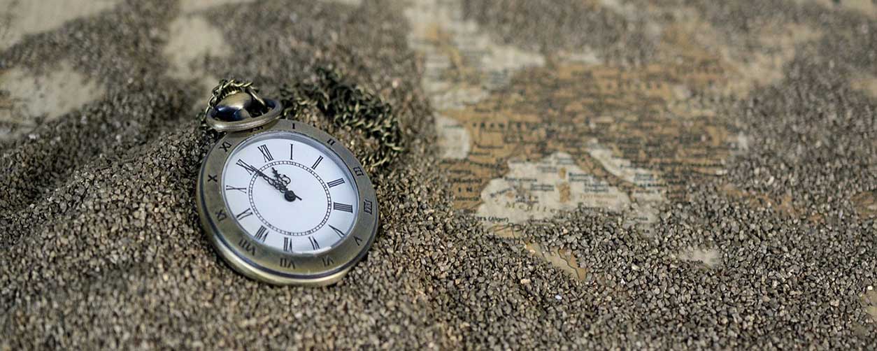 pocket watch in sand