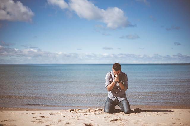 Prayer next to sea